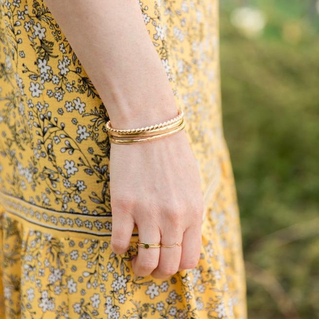 Gift of gold bangle stack jewelry of handmade local Lexington, Kentucky bracelets.
