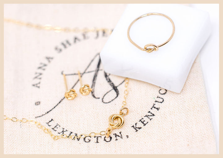 Love knot necklace, rings, and earrings