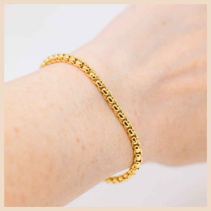 The Gold Box Chain Bracelet on wrist. Based in Lexington, Kentucky