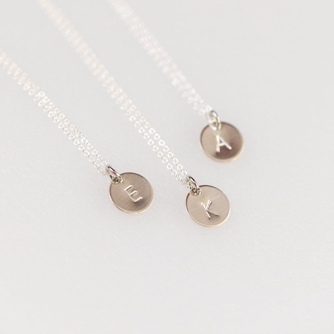 Minimalist silver disk necklace with initial on a chain by Anna Shae Jewelry in Lexington, Kentucky