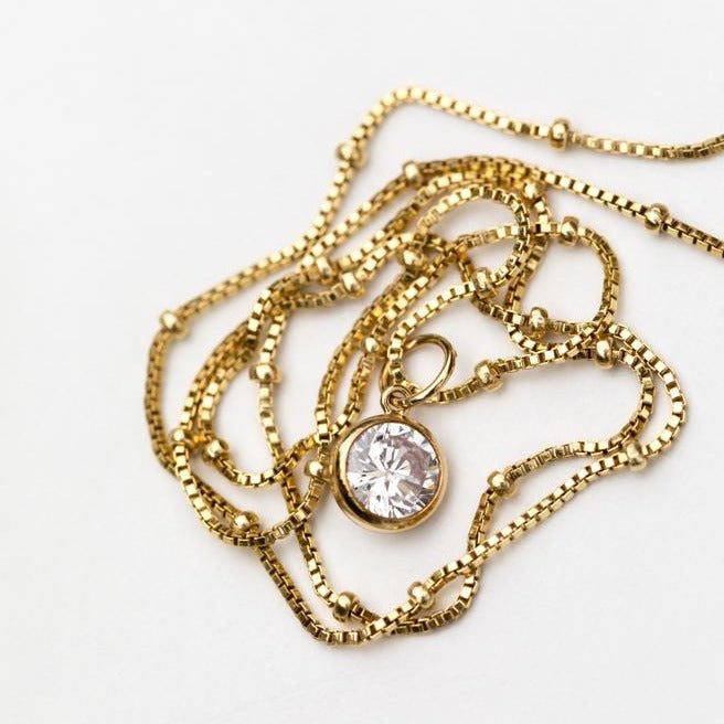 CZ cubic zirconia pendant on a gold bead chain by Anna Shae Jewelry in Lexington, Kentucky 
