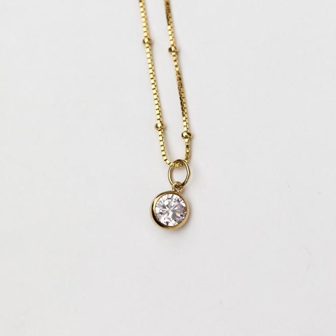 Small minimalistic crystal pendant on a gold chain in Lexington, Kentucky by Anna Shae Jewelry 