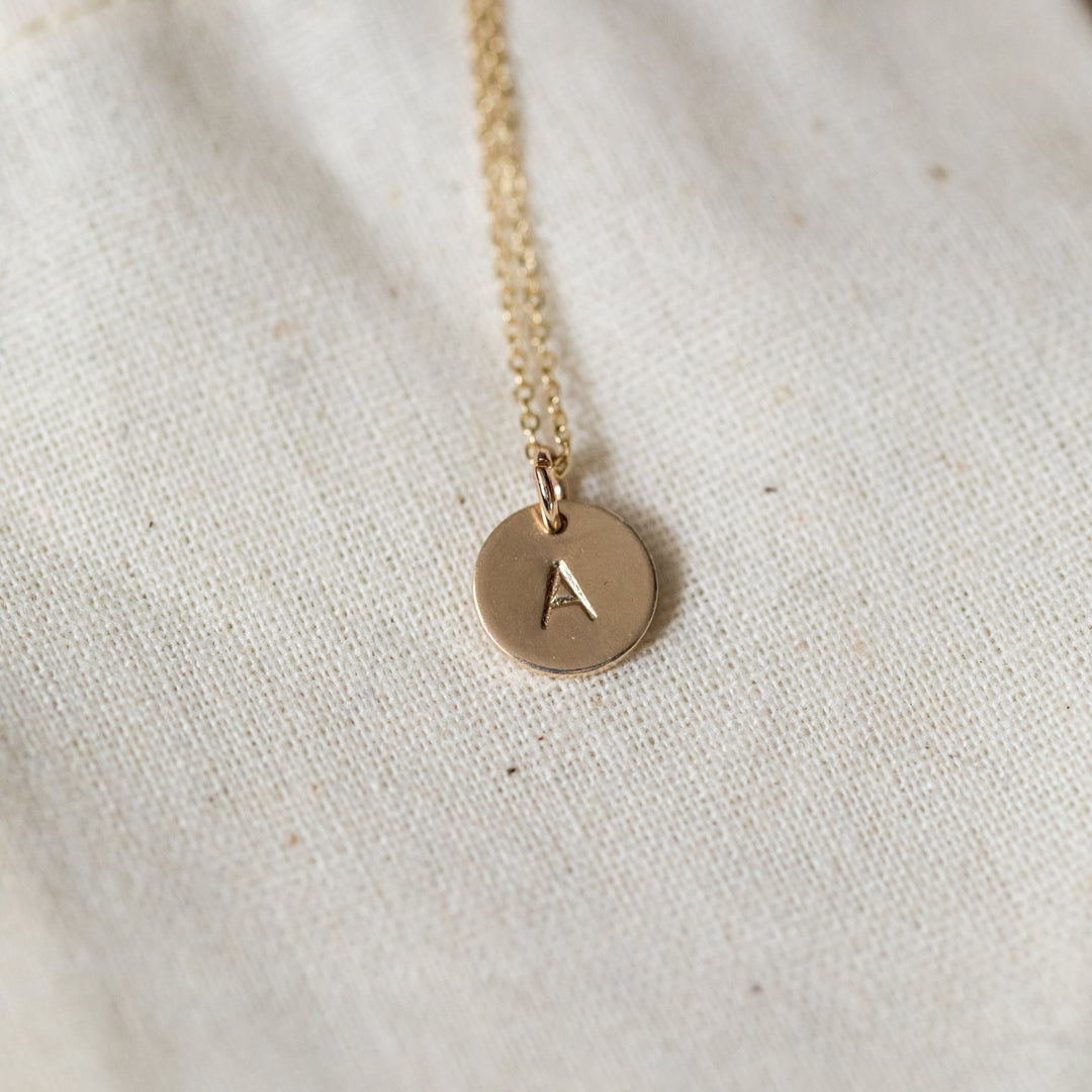 small round circle initial disk gold necklace by Anna Shae Jewelry in Lexington, Kentucky 